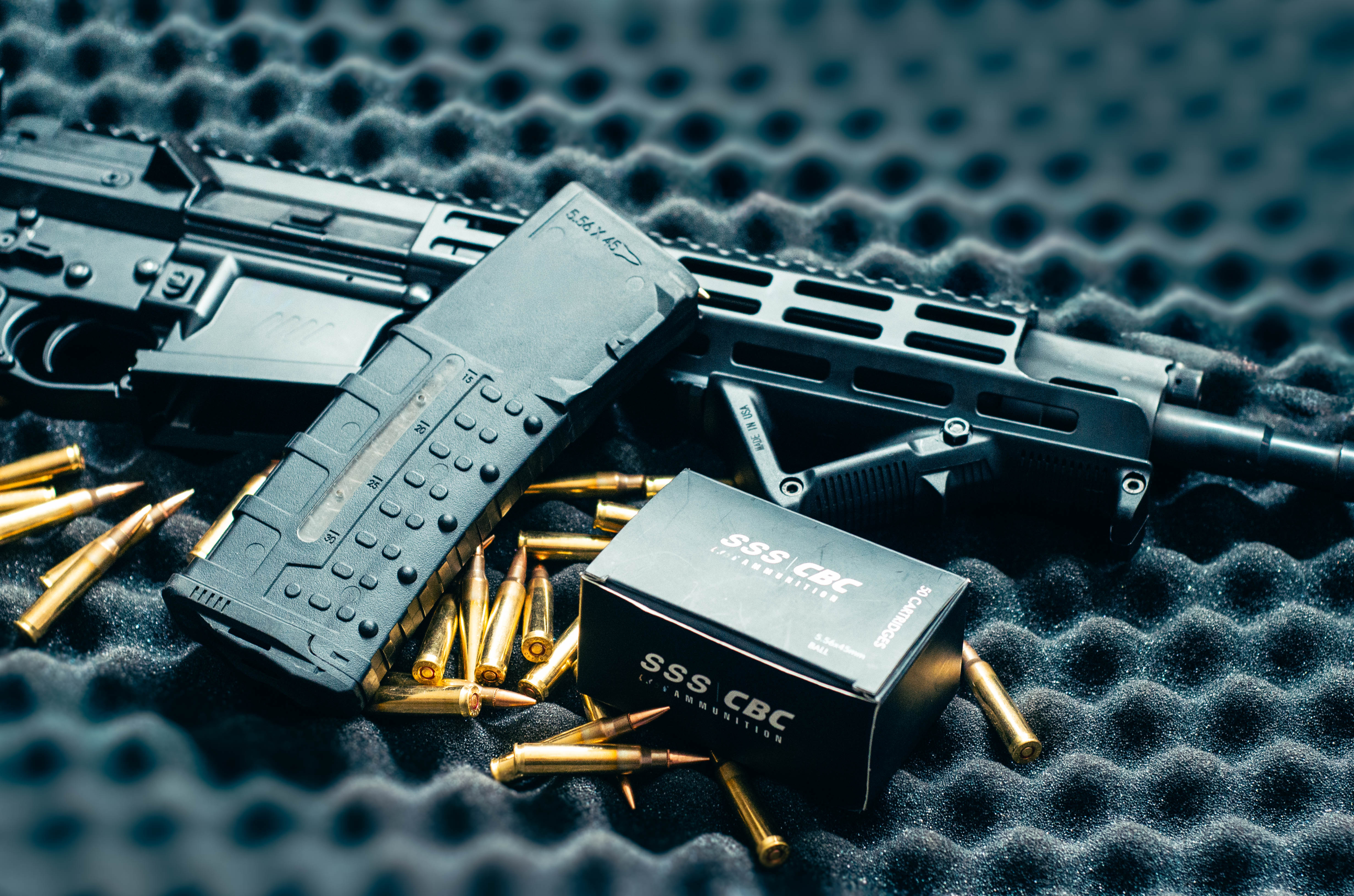 SSS Defence rifle, magazine, and ammunition on tactical foam
